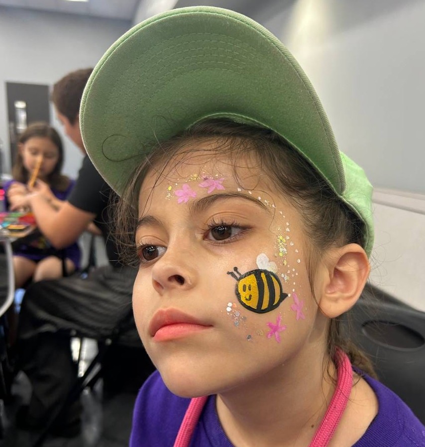 Bumblebee face painting at a Texas birthday party