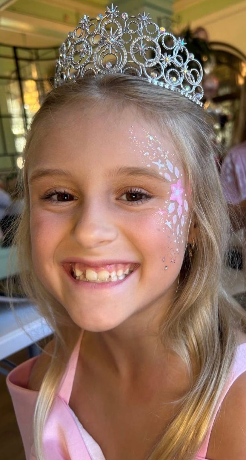 Flower face painting on a child at a Texas party